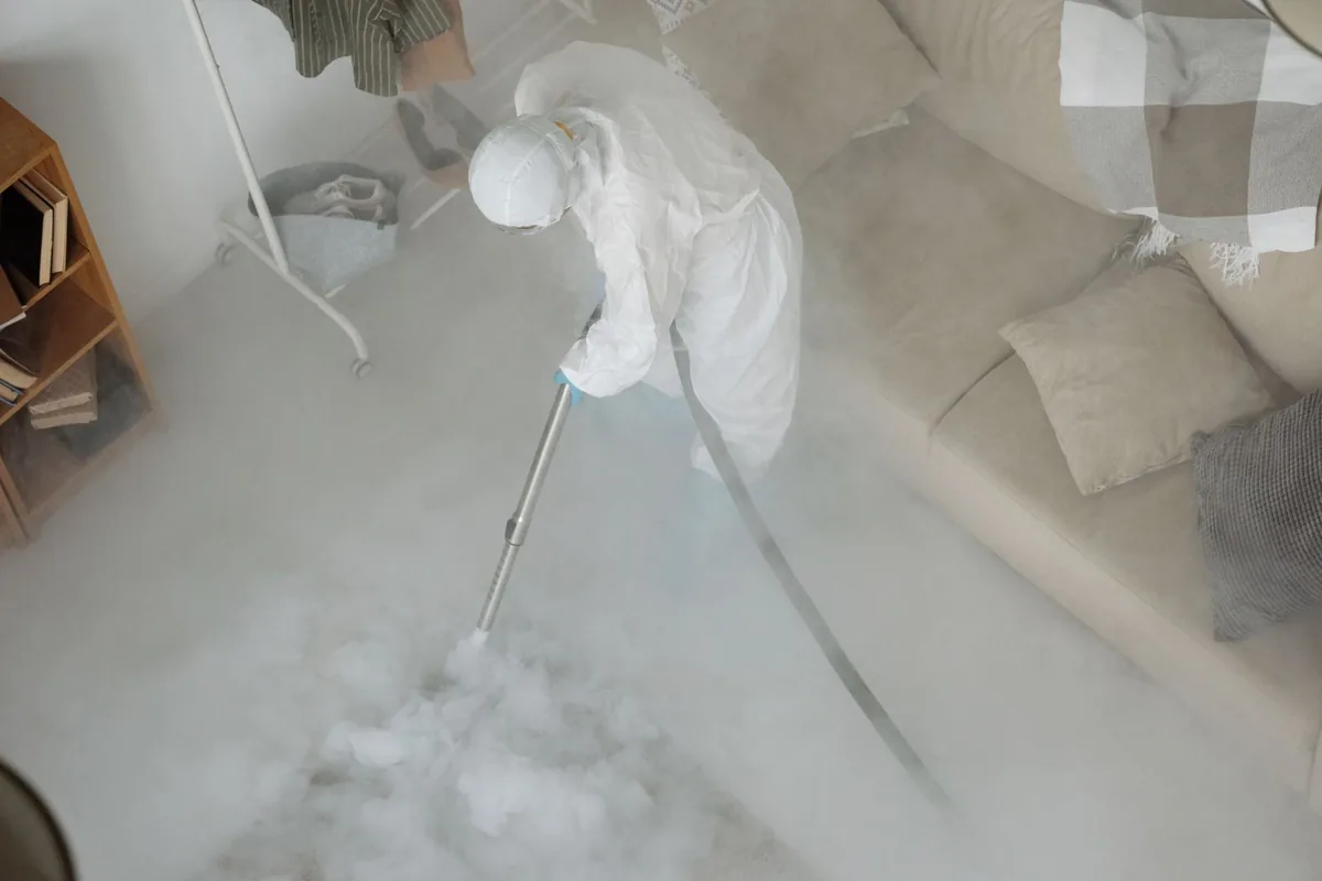 Biohazard cleanup technician in protective equipment, Falls Creek, PA